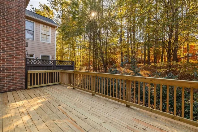 a view of deck with wooden floor and fence
