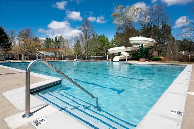 a view of a swimming pool with a patio