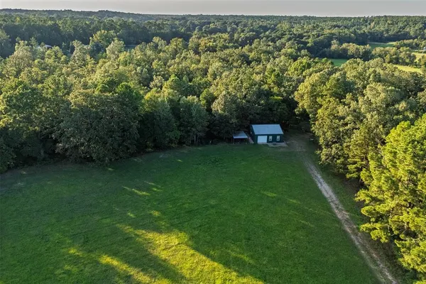 a view of a city with lots of residential buildings and green space