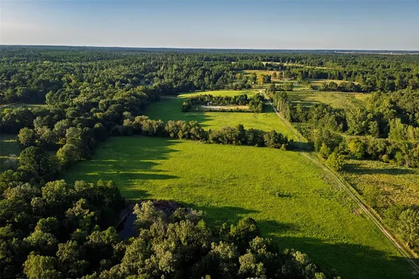 a view of a lake with a yard