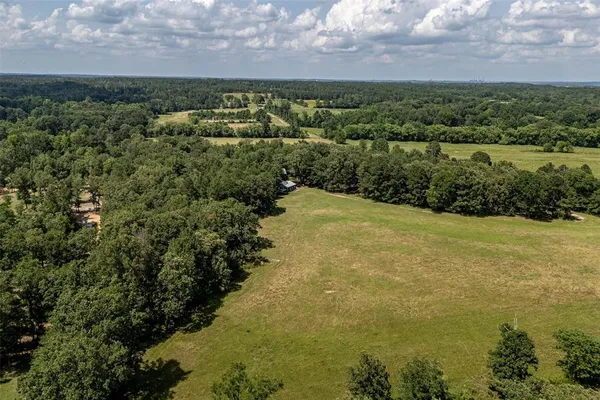 a view of a water pond with green space