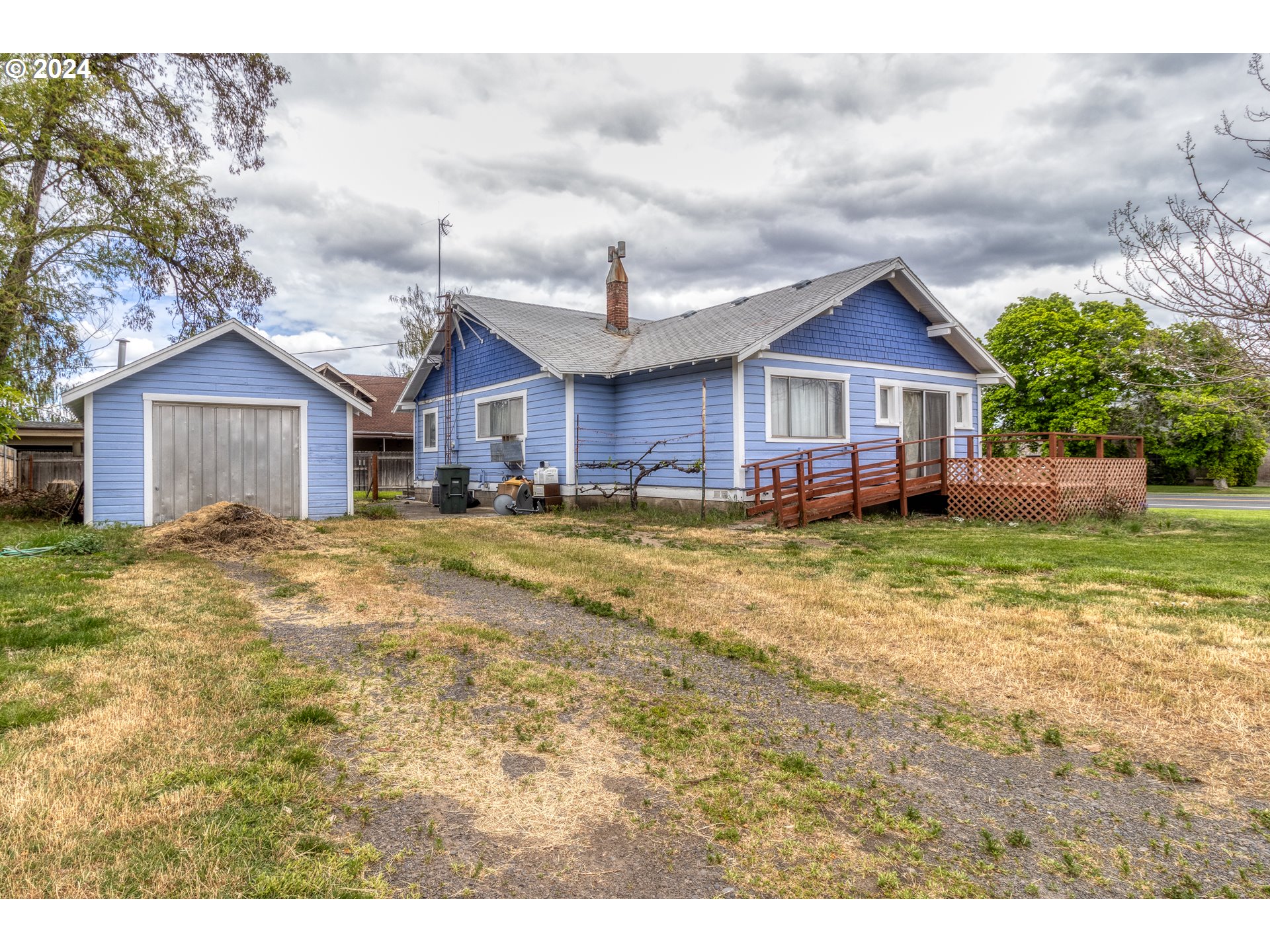 644 South Main Street Milton Freewater, OR 97862 - Photo 23 of 24 a view of a house with a big yard and large trees