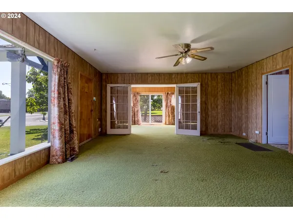 a view of an empty room with a window