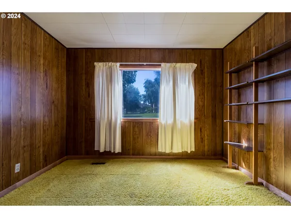 a view of outdoor space with wooden floor