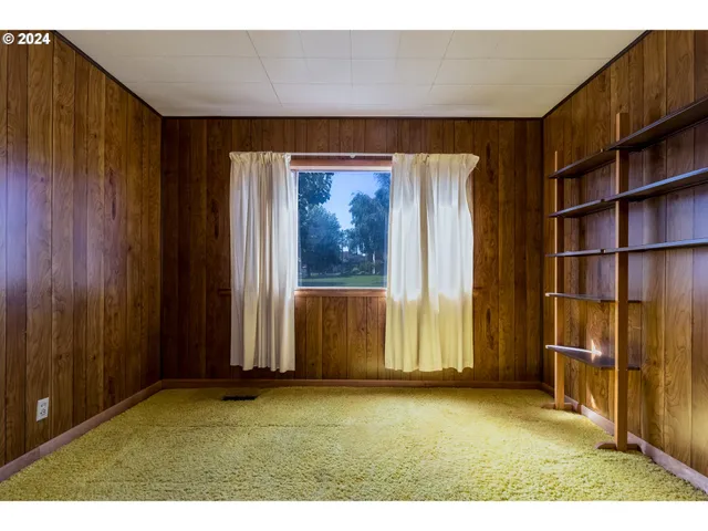 a view of outdoor space with wooden floor