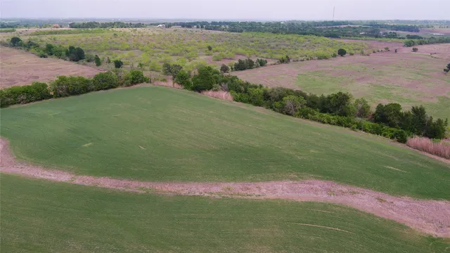 a view of a lake with a yard