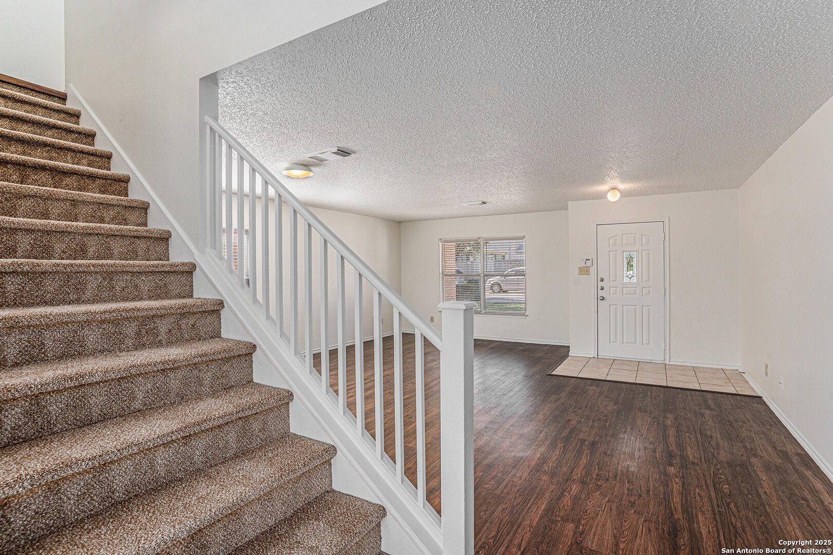 8447 Mannington Place Converse, TX 78109 - Photo 4 of 26 a view of an entryway with wooden floor