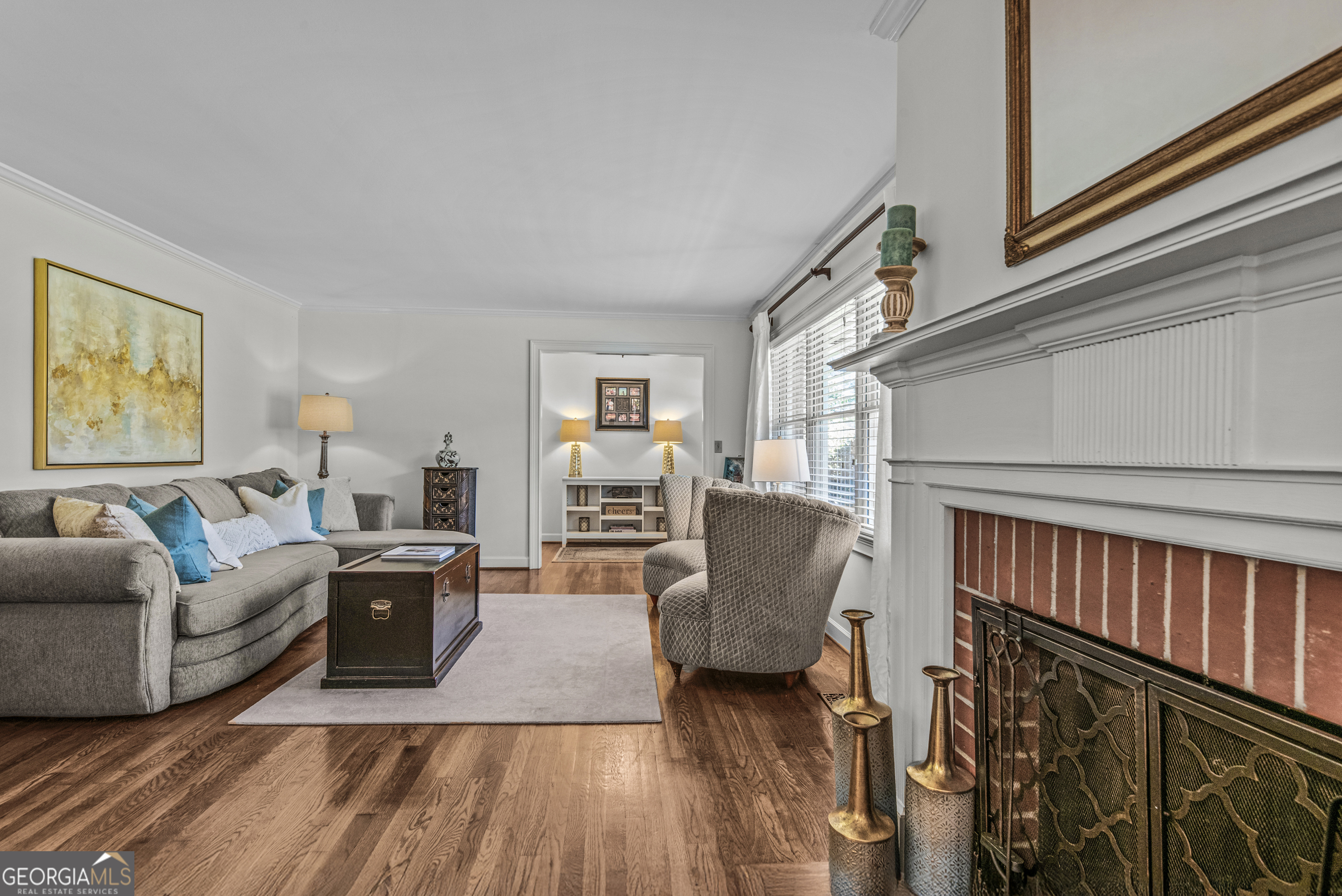 991 Old Post Road Madison, GA 30650 - Photo 12 of 61 a living room with fireplace furniture and a wooden floor