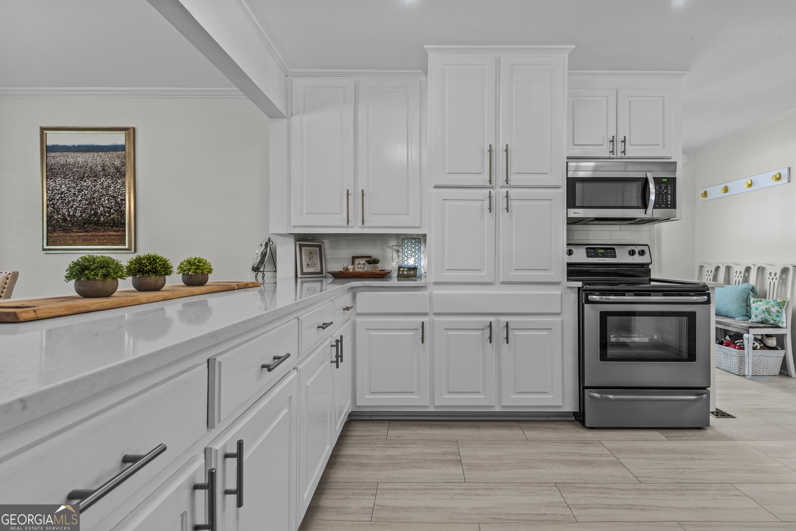 991 Old Post Road Madison, GA 30650 - Photo 15 of 61 a kitchen with cabinets stainless steel appliances and a counter space