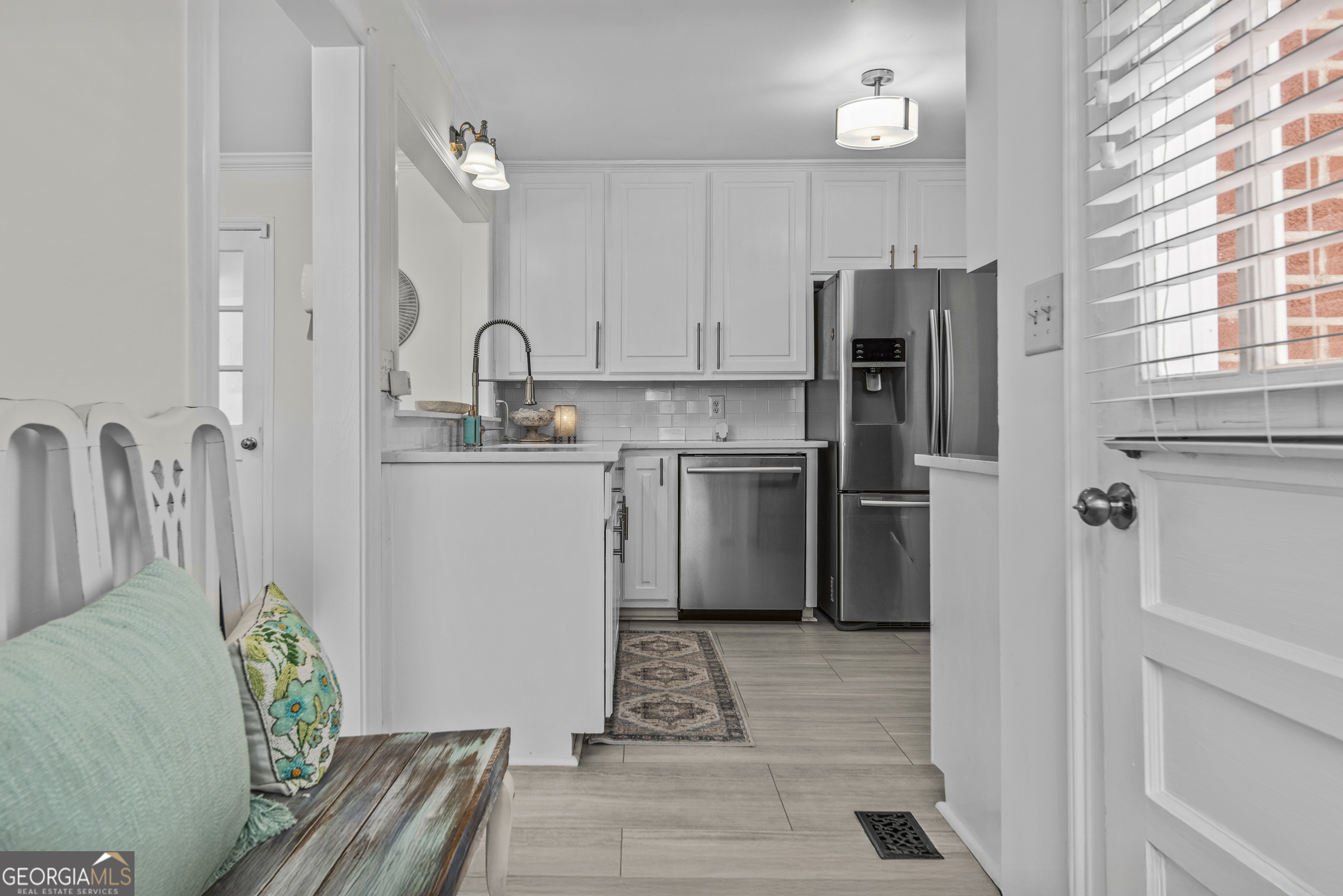 991 Old Post Road Madison, GA 30650 - Photo 19 of 61 a kitchen with stainless steel appliances granite countertop a refrigerator sink and cabinets