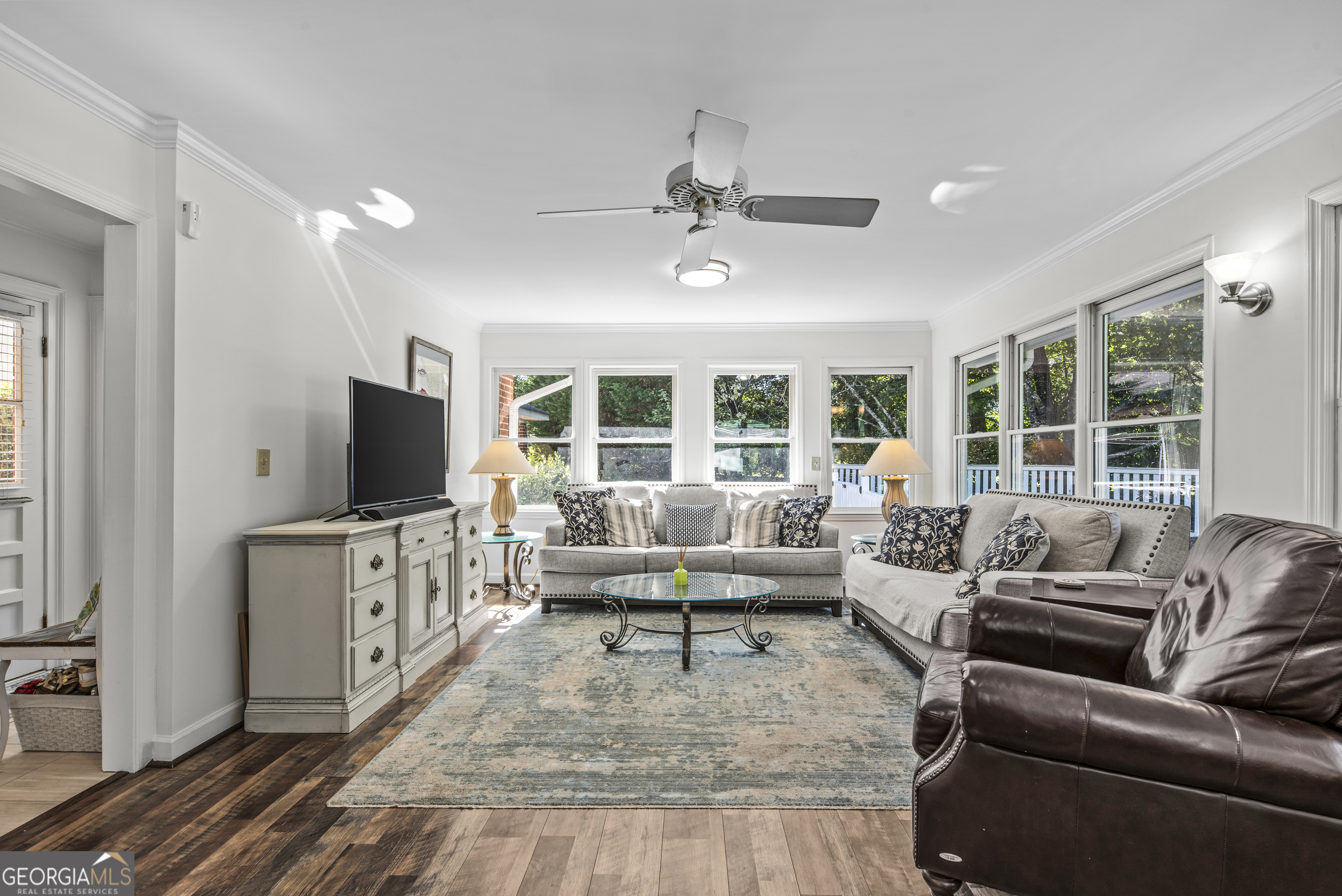 991 Old Post Road Madison, GA 30650 - Photo 23 of 61 a living room with furniture and a flat screen tv