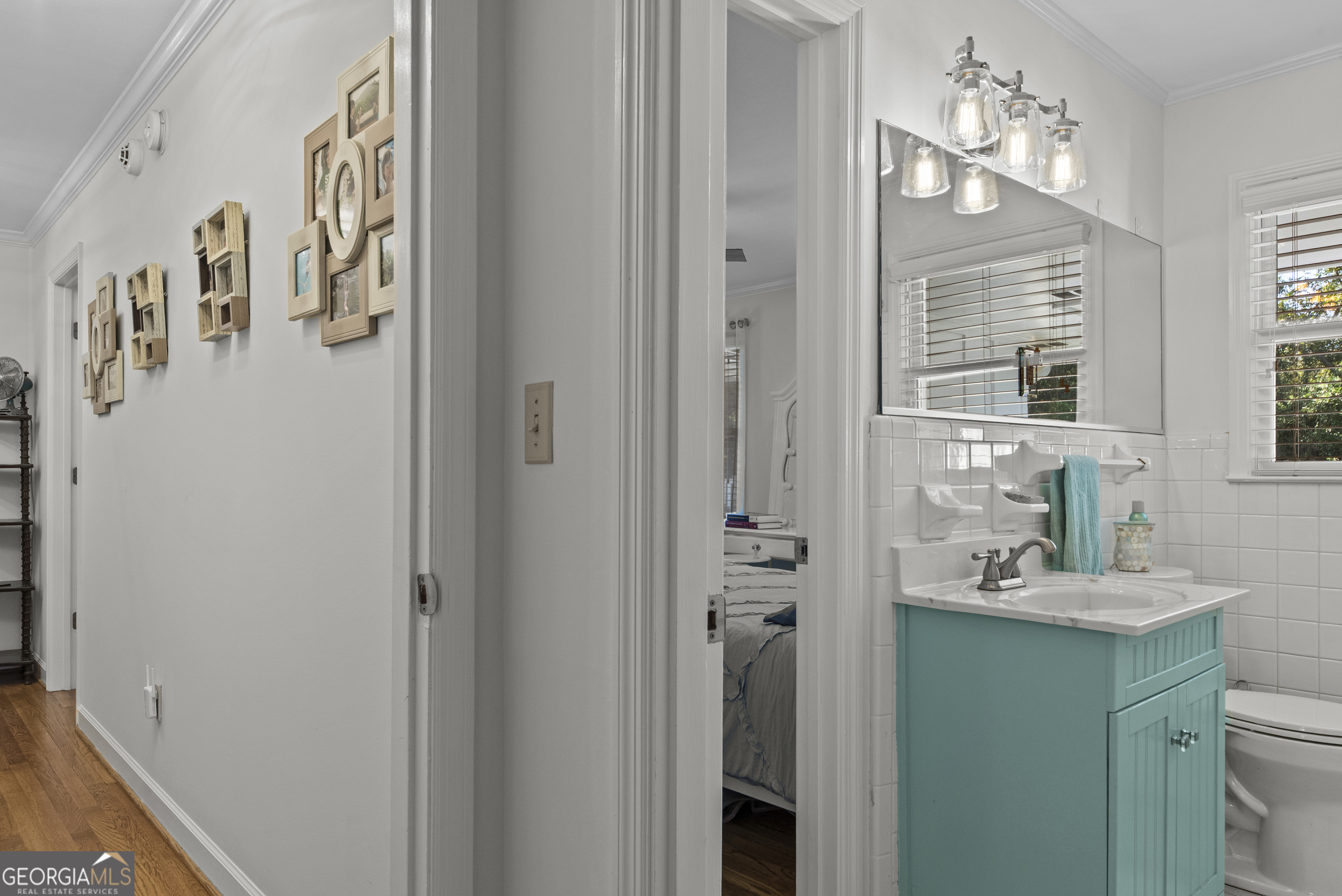 991 Old Post Road Madison, GA 30650 - Photo 31 of 61 a bathroom with a sink a mirror and a shower