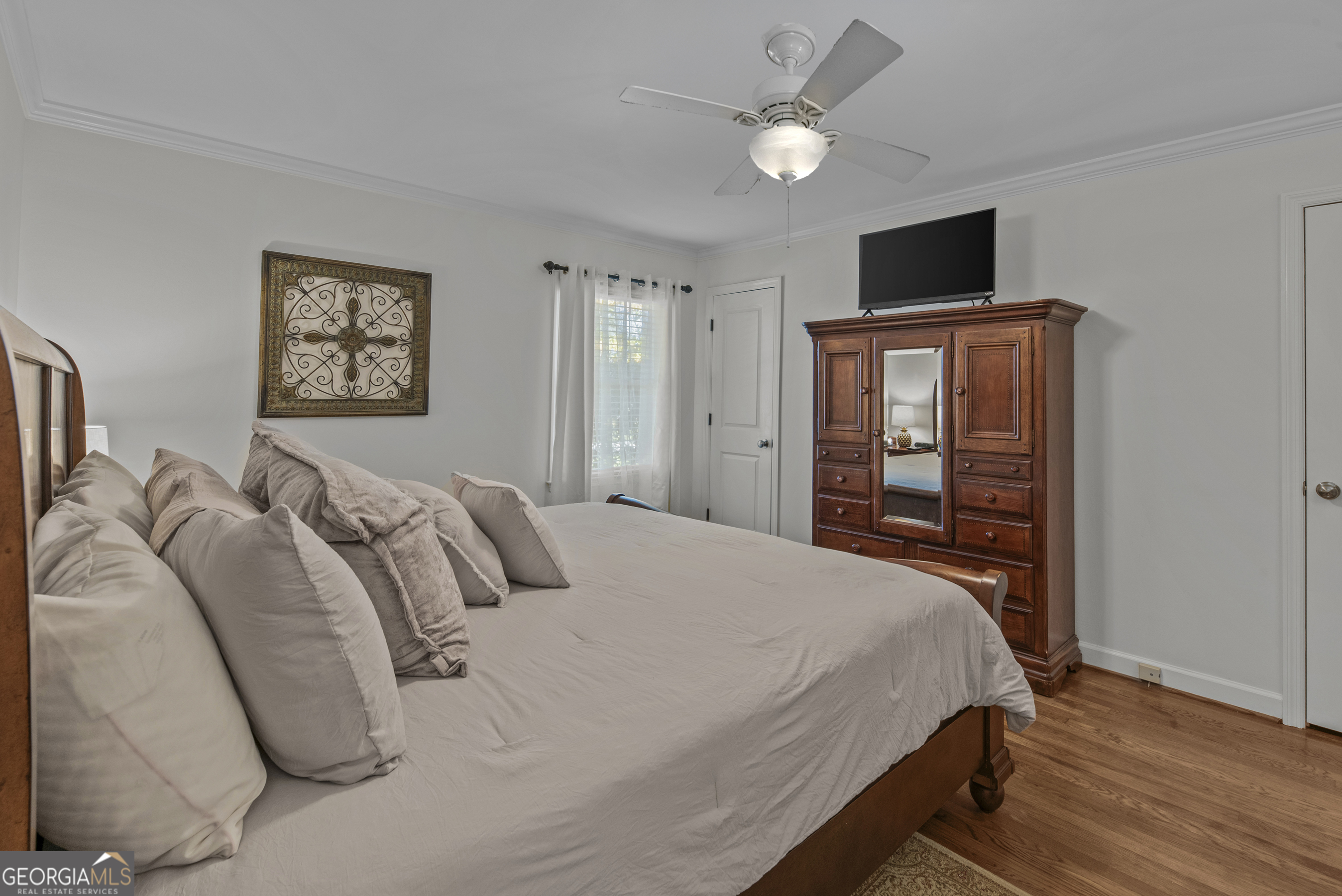 991 Old Post Road Madison, GA 30650 - Photo 39 of 61 a bedroom with a bed and a flat screen tv