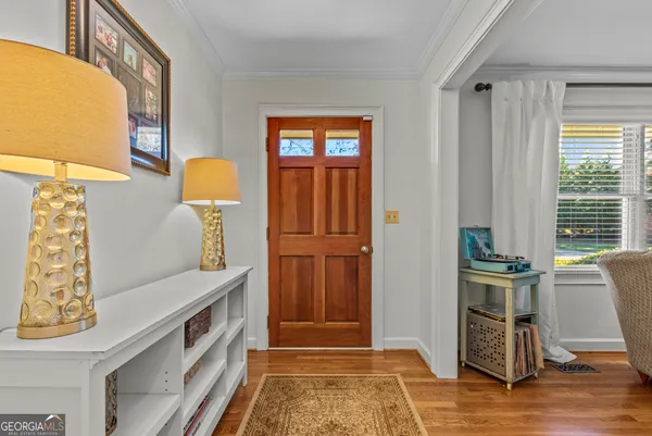a view of a house with backyard porch and sitting area