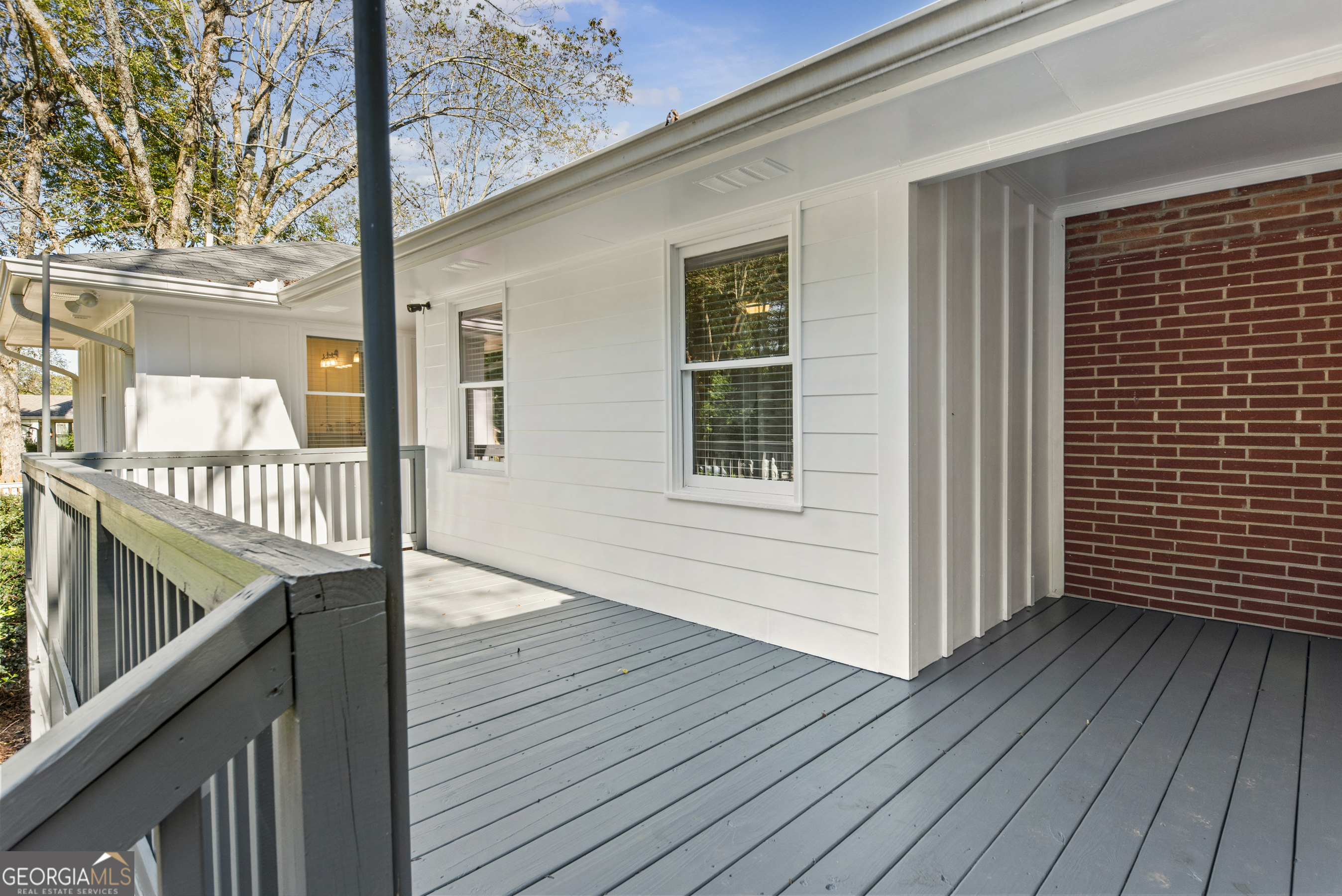 991 Old Post Road Madison, GA 30650 - Photo 44 of 61 a view of a balcony with wooden floor and fence