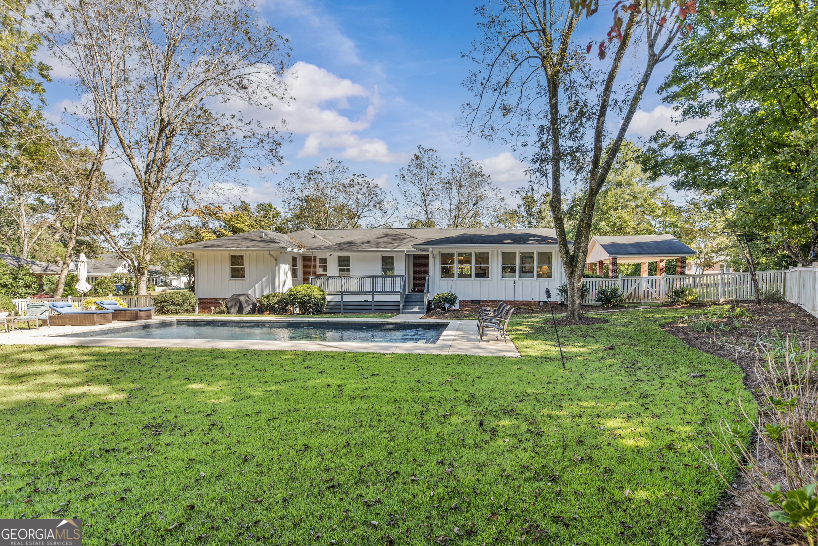 991 Old Post Road Madison, GA 30650 - Photo 49 of 61 a view of a house with backyard sitting area and garden