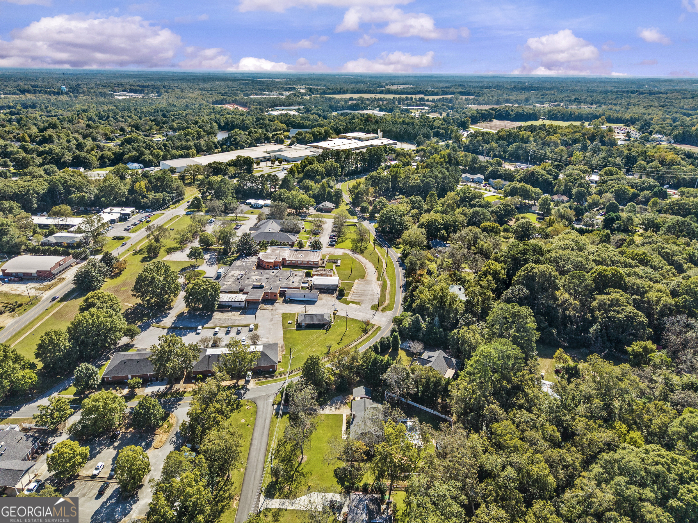 991 Old Post Road Madison, GA 30650 - Photo 58 of 61 an aerial view of residential houses with outdoor space and trees