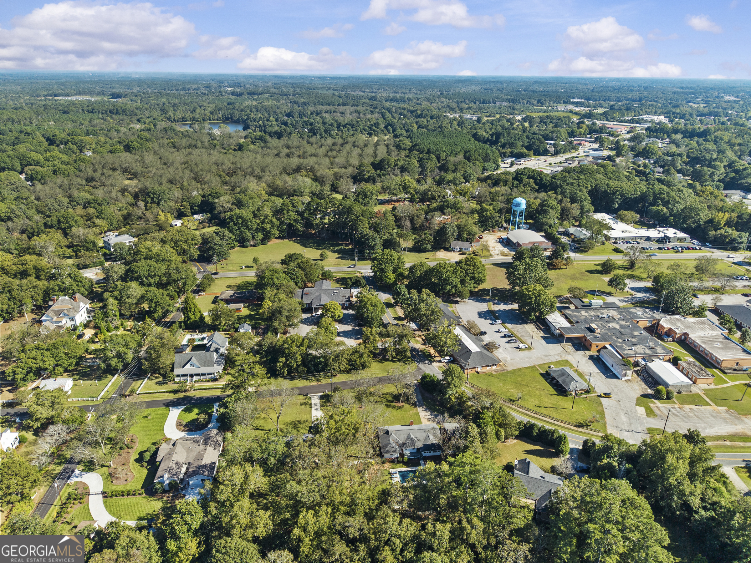 991 Old Post Road Madison, GA 30650 - Photo 59 of 61 an aerial view of residential houses with outdoor space and trees