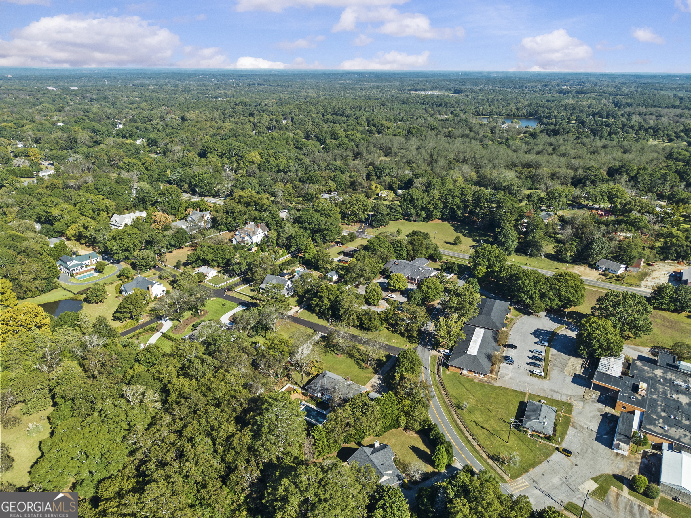 991 Old Post Road Madison, GA 30650 - Photo 60 of 61 an aerial view of residential houses with outdoor space and trees