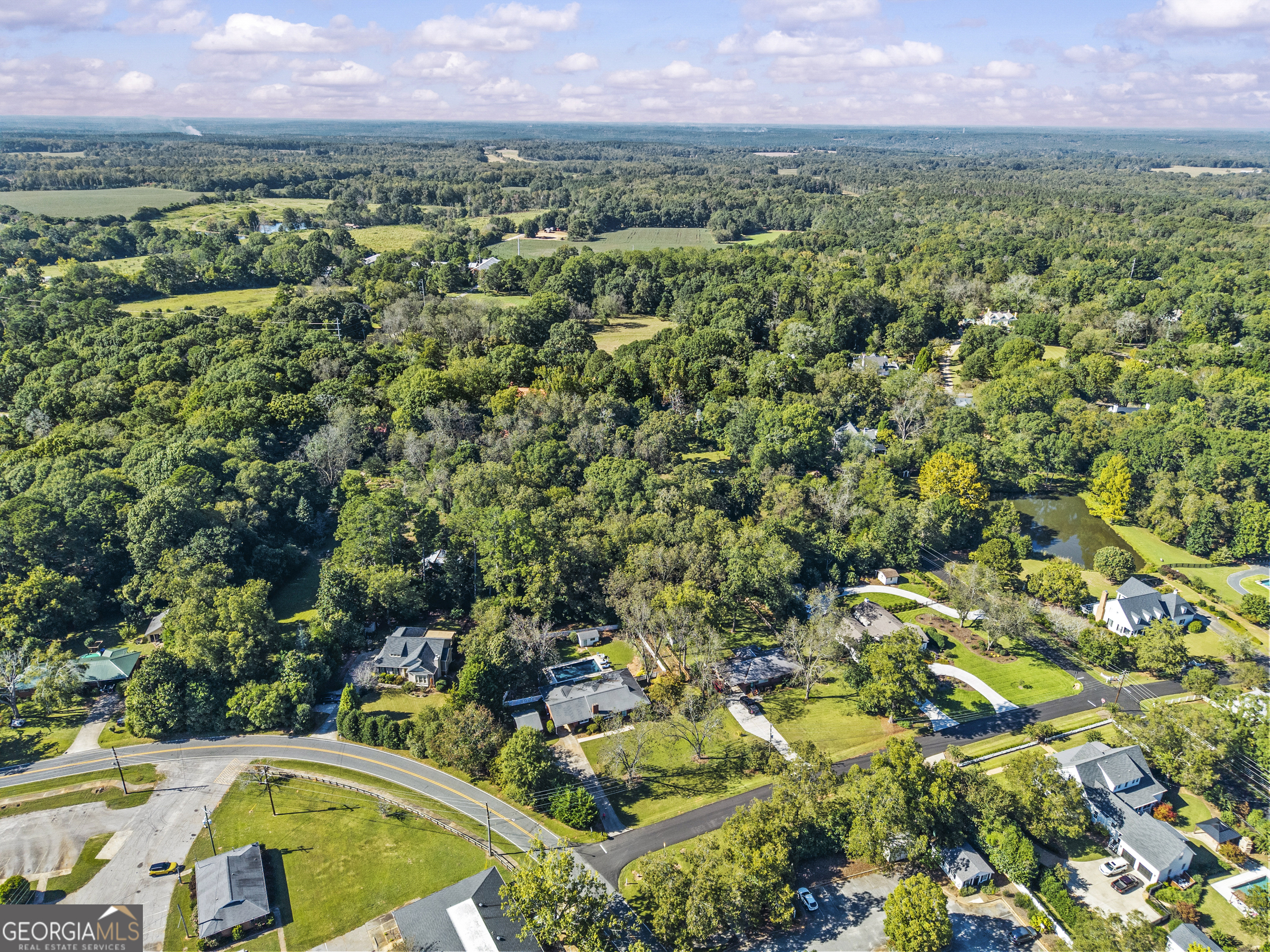 991 Old Post Road Madison, GA 30650 - Photo 61 of 61 an aerial view of residential houses with outdoor space and trees