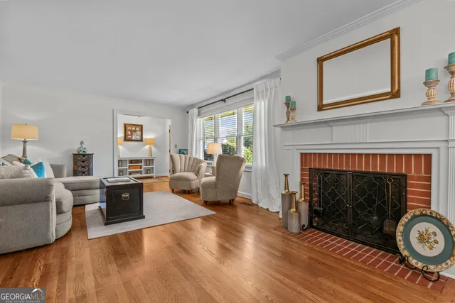 a view of a dining room with furniture and a chandelier