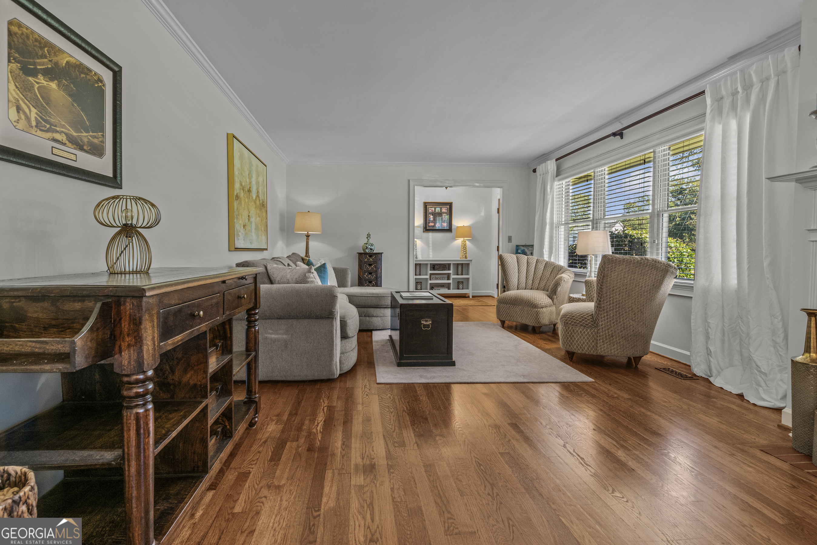 991 Old Post Road Madison, GA 30650 - Photo 9 of 61 a living room with furniture and a wooden floor