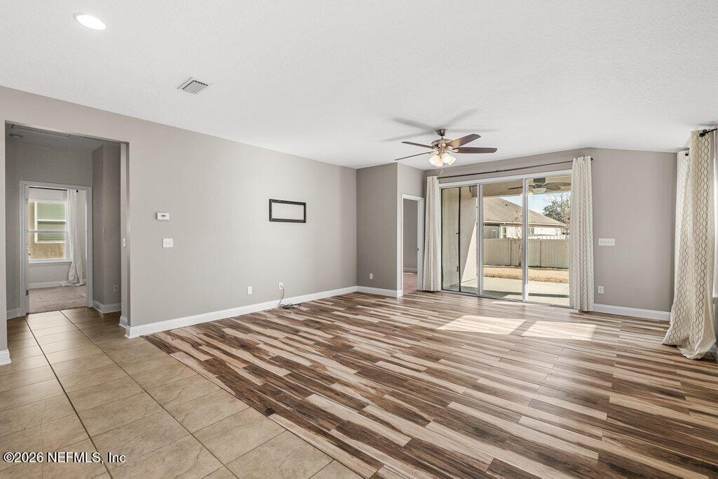 14042 Carson Court Jacksonville, FL 32224 - Photo 15 of 37 a view of a livingroom with wooden floor and a ceiling fan