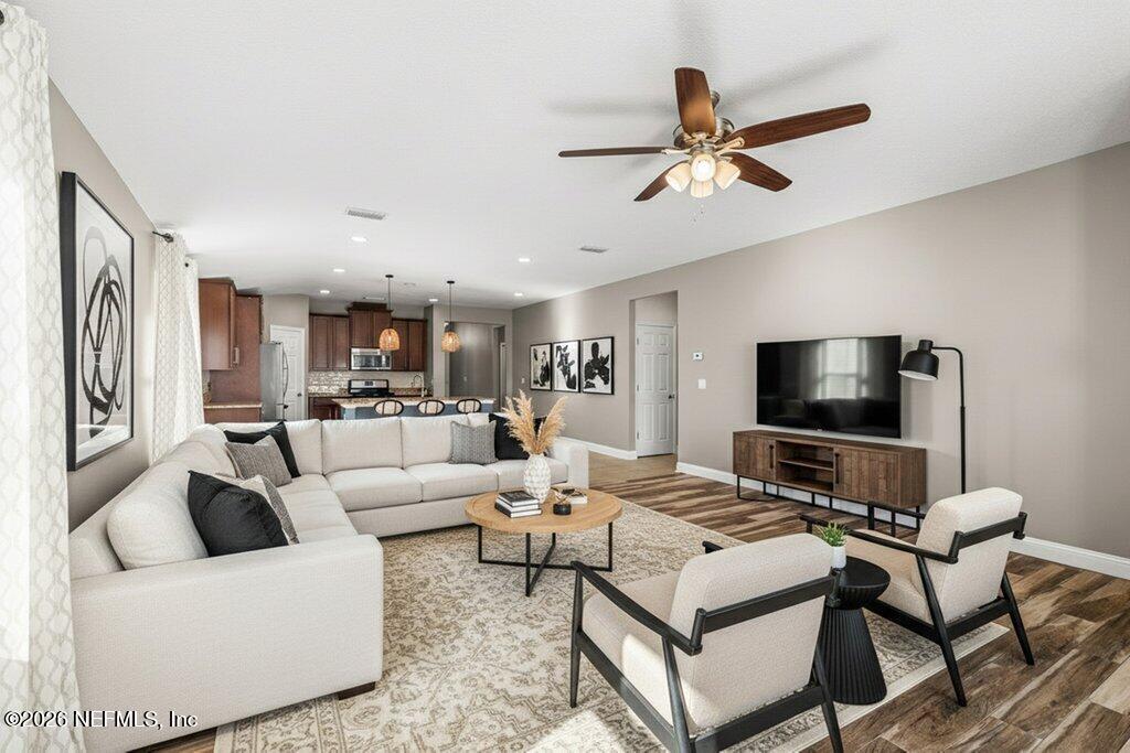 14042 Carson Court Jacksonville, FL 32224 - Photo 17 of 37 a living room with furniture and a flat screen tv