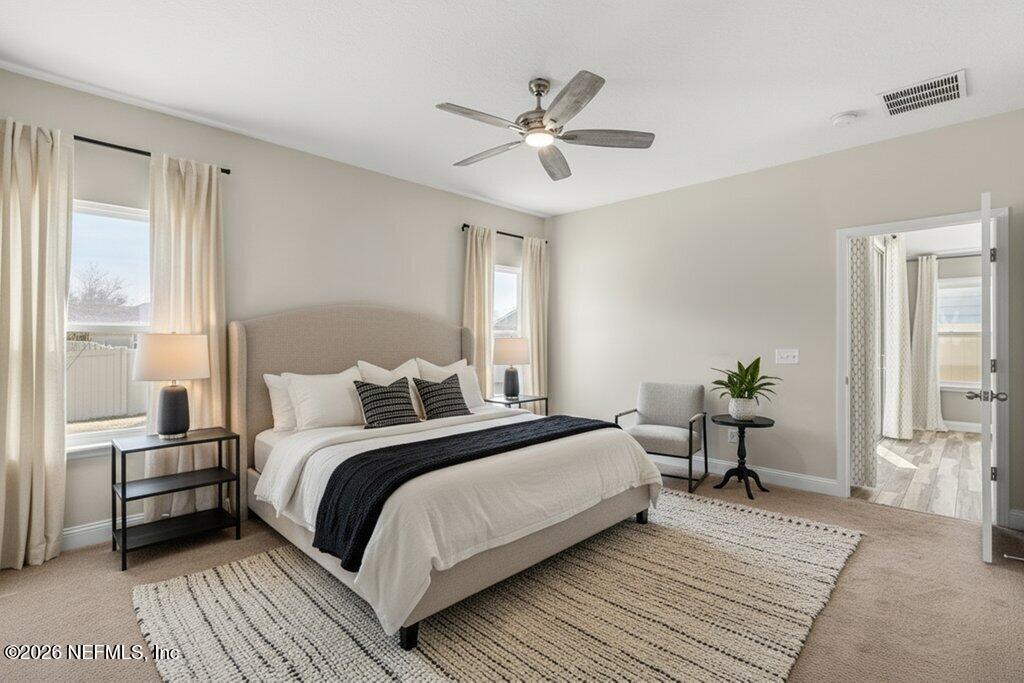 14042 Carson Court Jacksonville, FL 32224 - Photo 20 of 37 a bedroom with a bed and a window