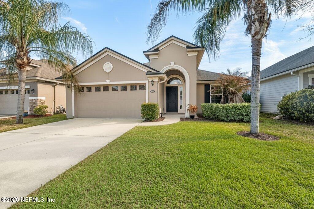 14042 Carson Court Jacksonville, FL 32224 - Photo 2 of 37 a front view of a house with a garden and yard