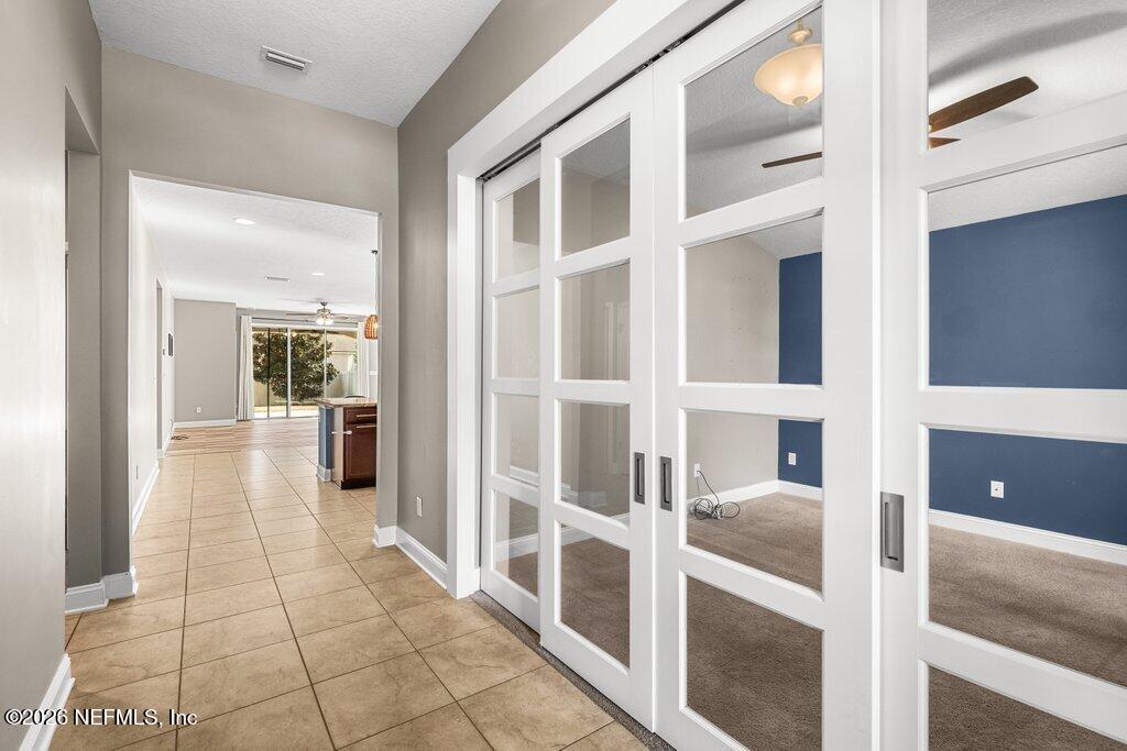 14042 Carson Court Jacksonville, FL 32224 - Photo 5 of 37 a view of a hallway with a living room space