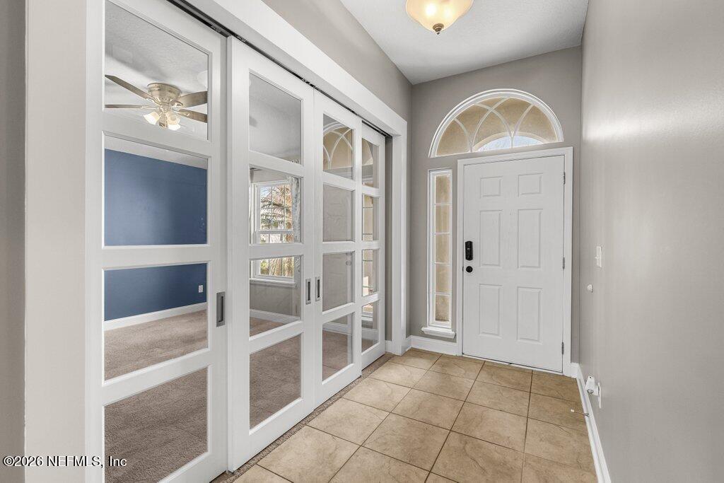 14042 Carson Court Jacksonville, FL 32224 - Photo 6 of 37 a view of an entryway with wooden floor