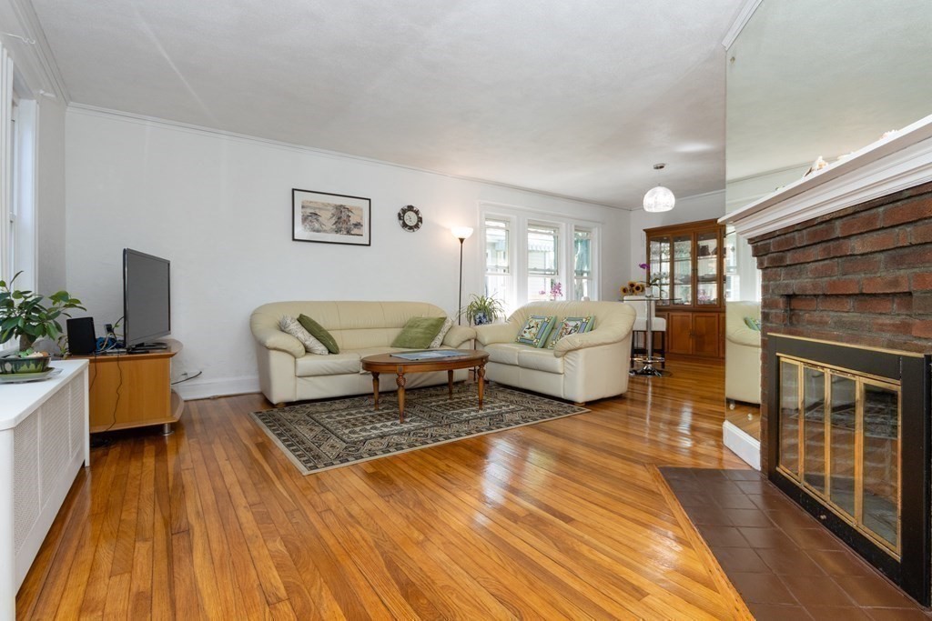 16 Libbey Street Boston, MA 02132 - Photo 11 of 41 a living room with furniture and a fireplace