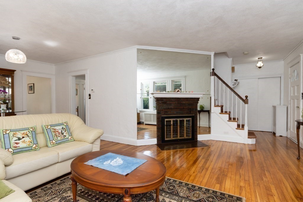 16 Libbey Street Boston, MA 02132 - Photo 12 of 41 a living room with furniture and a fireplace