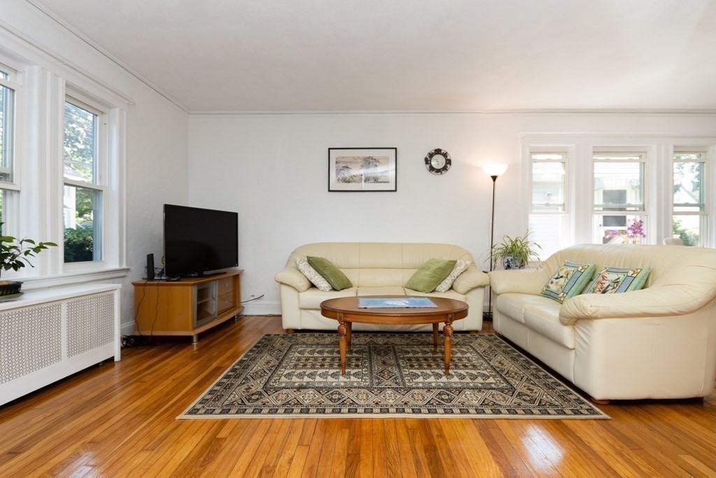 16 Libbey Street Boston, MA 02132 - Photo 13 of 41 a living room with furniture and a flat screen tv