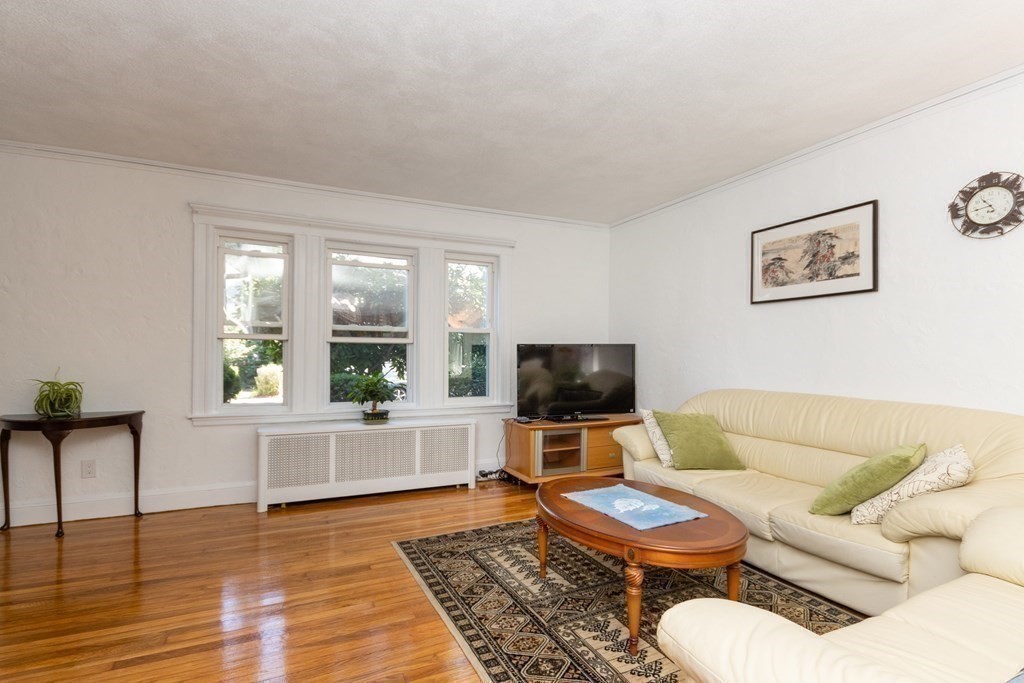16 Libbey Street Boston, MA 02132 - Photo 14 of 41 a living room with furniture and a flat screen tv