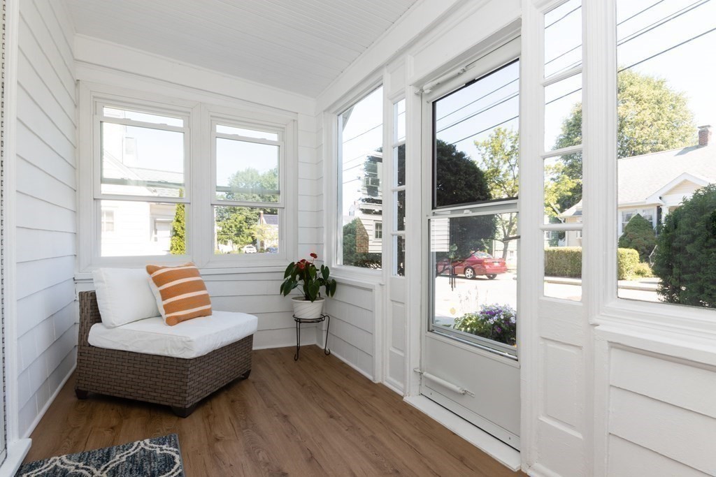 16 Libbey Street Boston, MA 02132 - Photo 2 of 41 a living room with furniture and a large window
