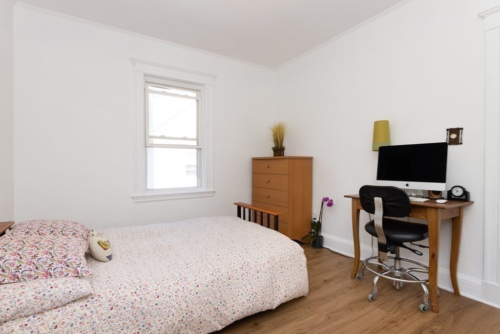 16 Libbey Street Boston, MA 02132 - Photo 24 of 41 a bedroom with a bed and a computer on a table