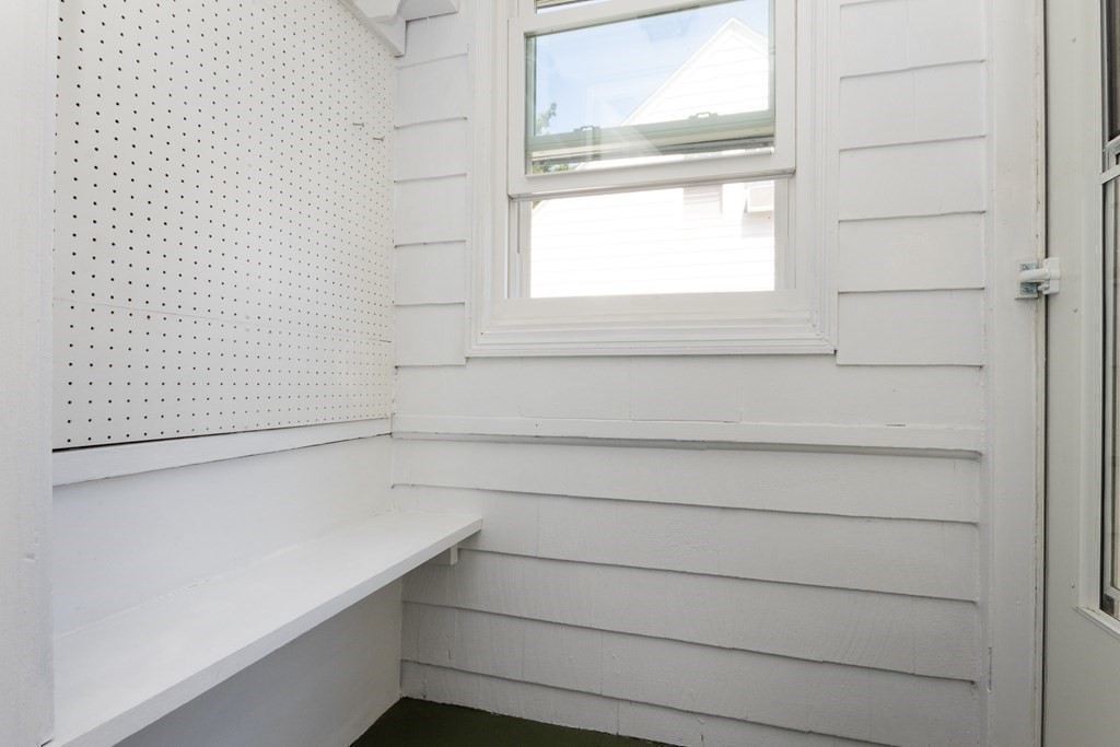 16 Libbey Street Boston, MA 02132 - Photo 27 of 41 a view of a closet area with a window