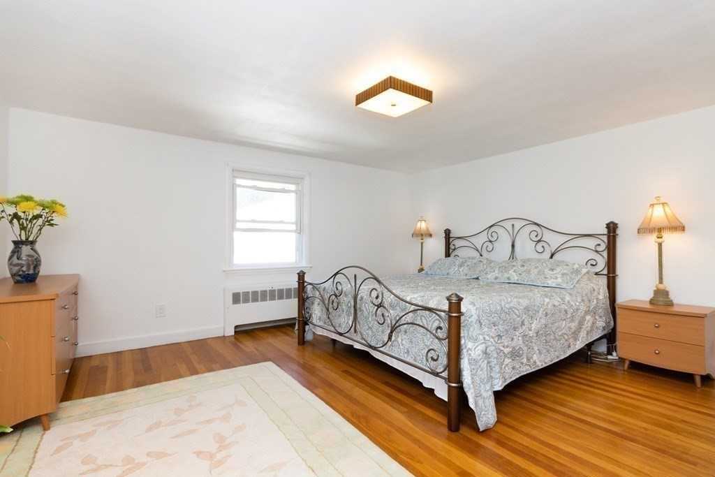16 Libbey Street Boston, MA 02132 - Photo 30 of 41 a bedroom with a bed and window