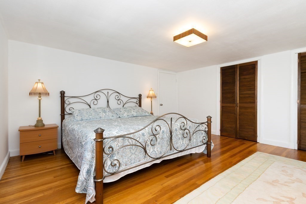 16 Libbey Street Boston, MA 02132 - Photo 31 of 41 a bedroom with a bed next to a window