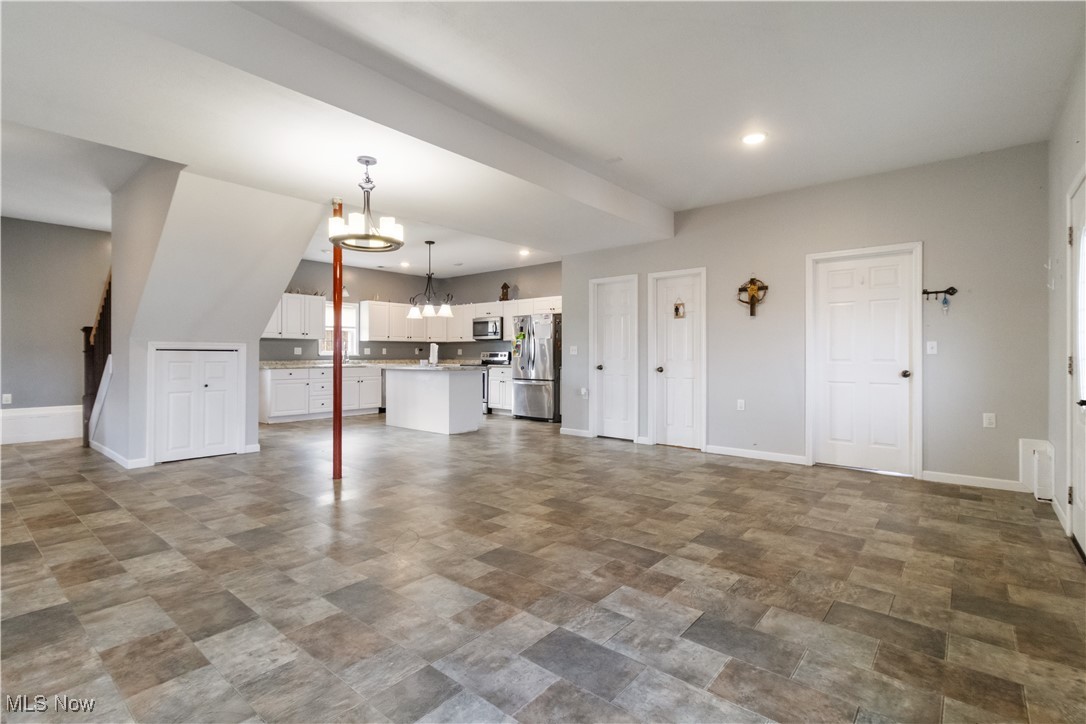 57459 Shry Road Barnesville, OH 43713 - Photo 7 of 44 Unfurnished living room featuring a chandelier and recessed lighting