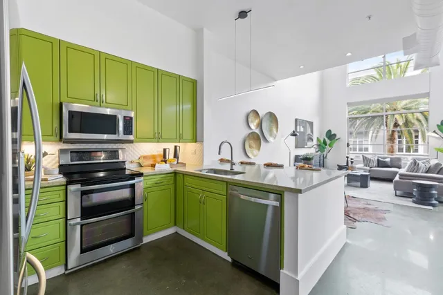 a kitchen with a sink and a stove top oven