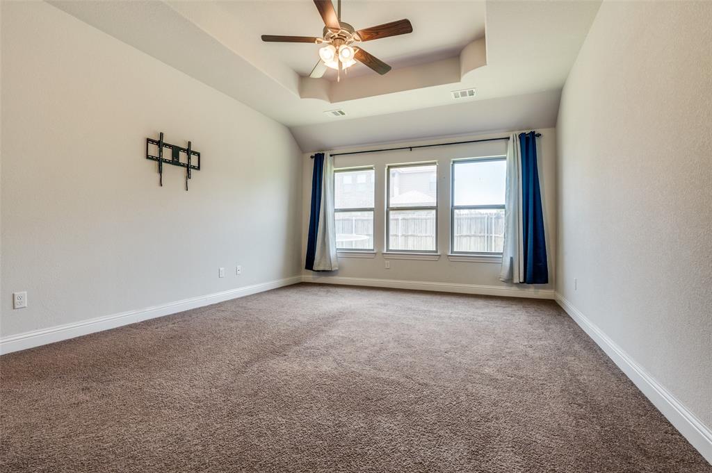 426 Summer Grove Drive Midlothian, TX 76065 - Photo 14 of 25 an empty room with windows and fan