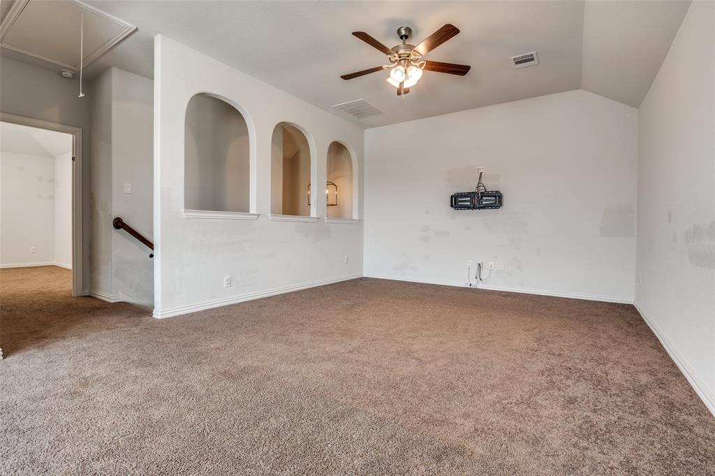 426 Summer Grove Drive Midlothian, TX 76065 - Photo 19 of 25 an empty room with windows and ceiling fan