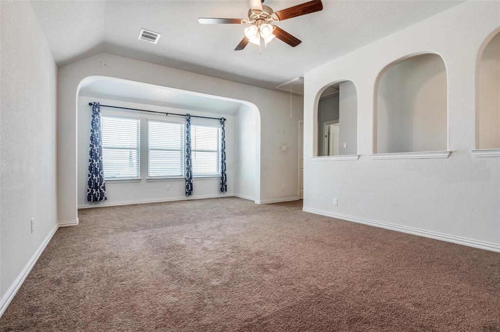 426 Summer Grove Drive Midlothian, TX 76065 - Photo 20 of 25 an empty room with chandelier fan and windows