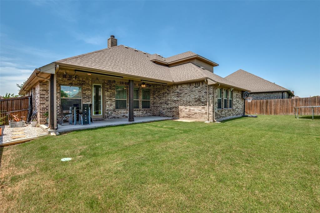 426 Summer Grove Drive Midlothian, TX 76065 - Photo 24 of 25 a front view of a house with a garden