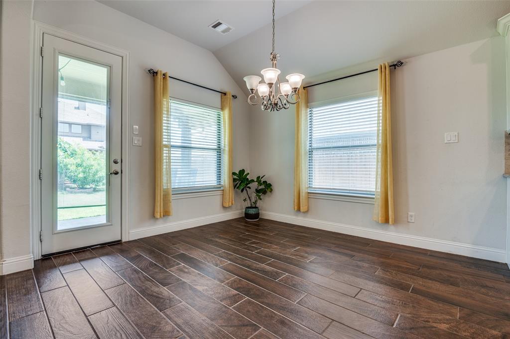 426 Summer Grove Drive Midlothian, TX 76065 - Photo 10 of 25 a view of a room with wooden floor and chandelier