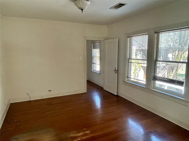 a view of an entryway with wooden floor