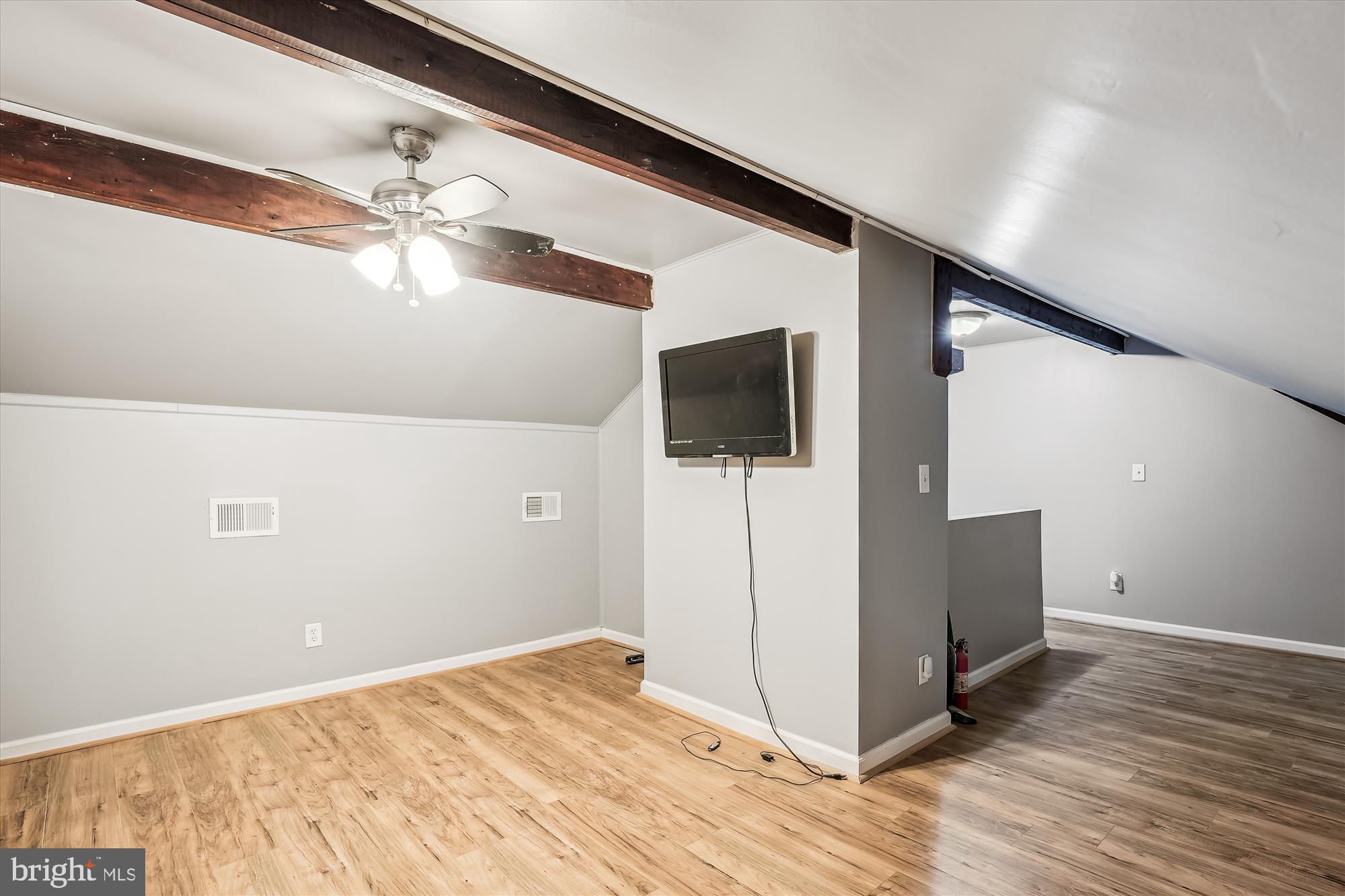 4860 28th Street South, Unit C2 Arlington, VA 22206 - Photo 21 of 34 Upstairs loft with exposed wood beams